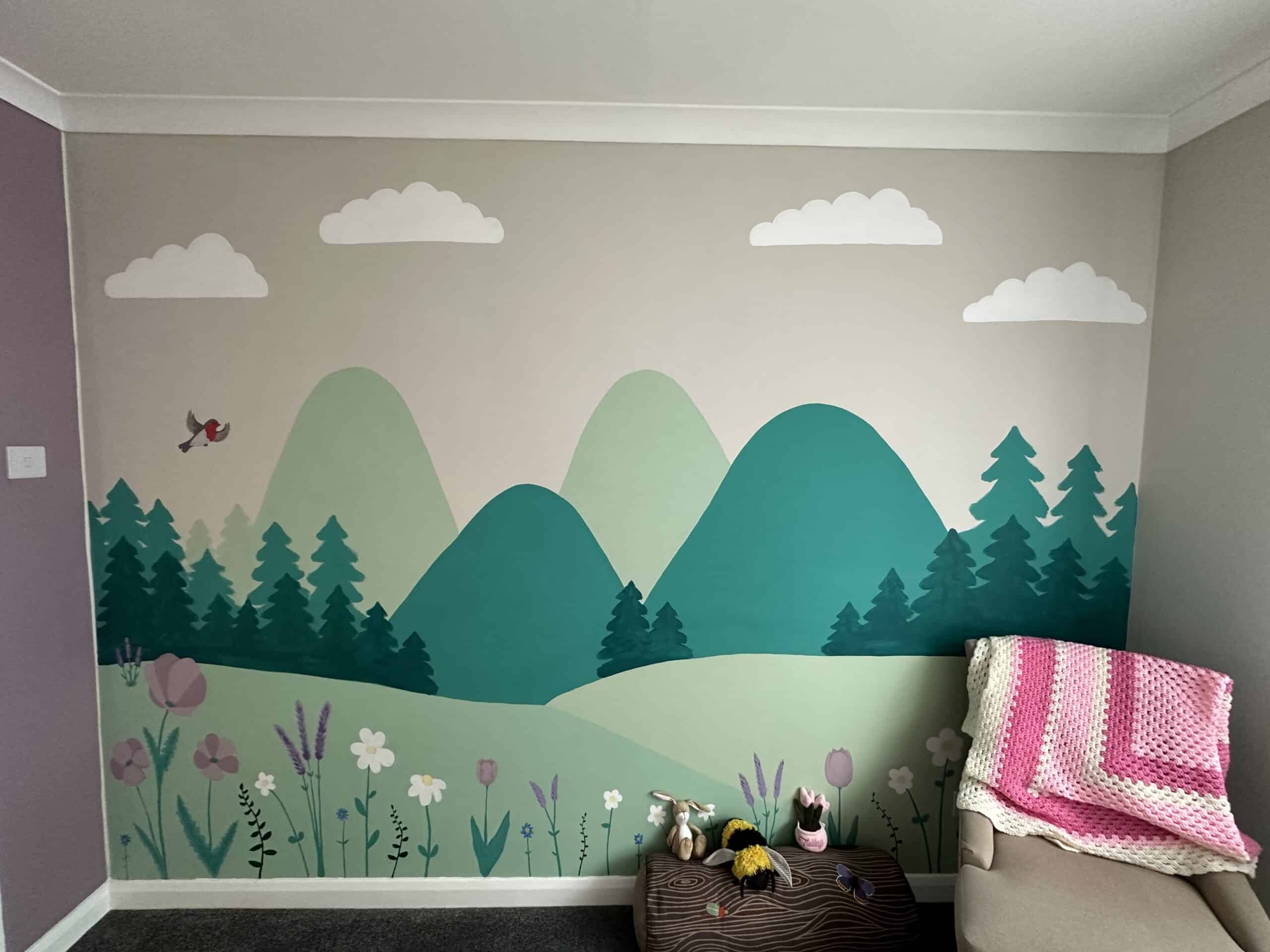 Colorful mountain and nature mural in a creative space.
