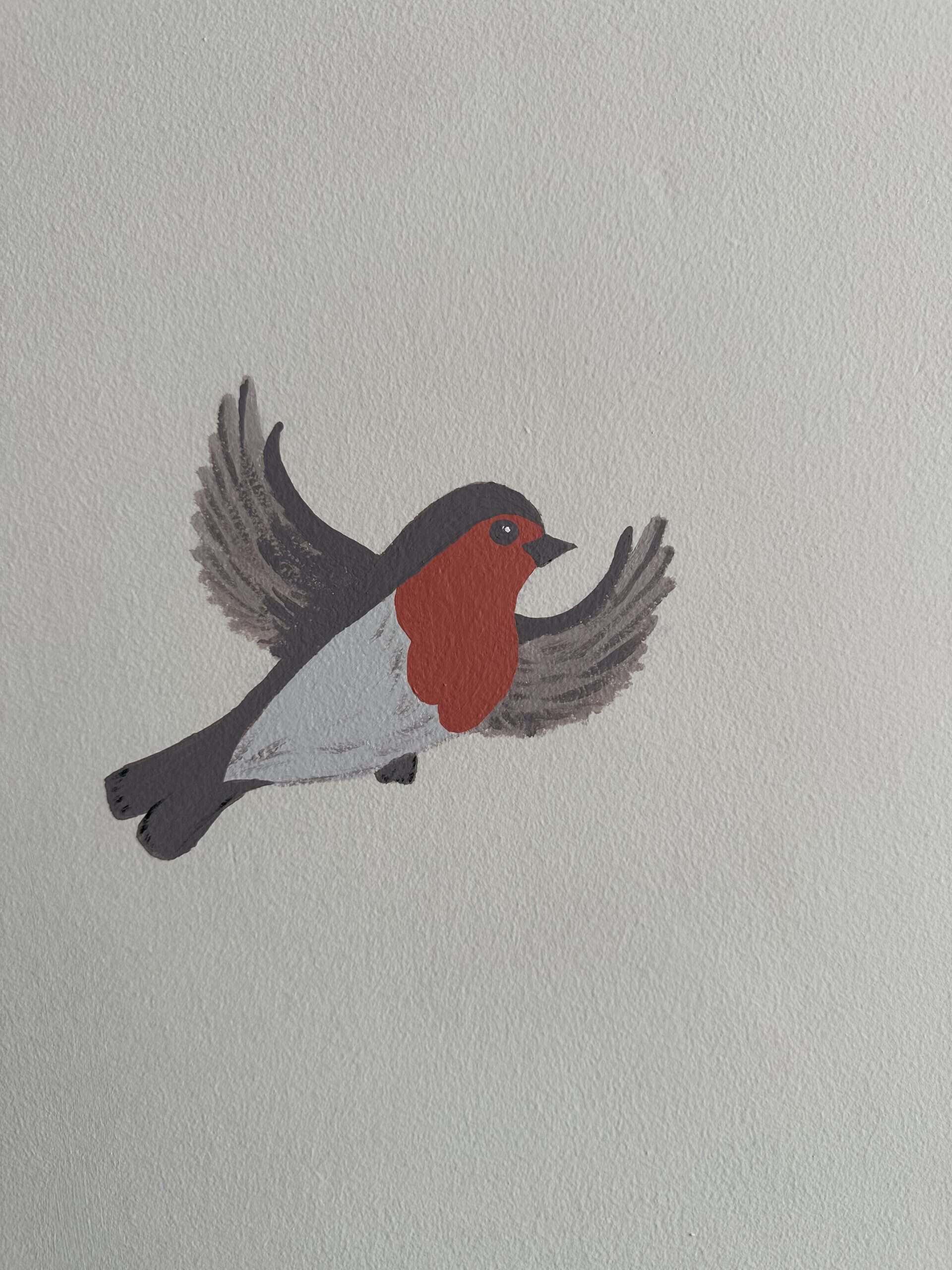 Decorative bird illustration representing Kingfisher Creative House.