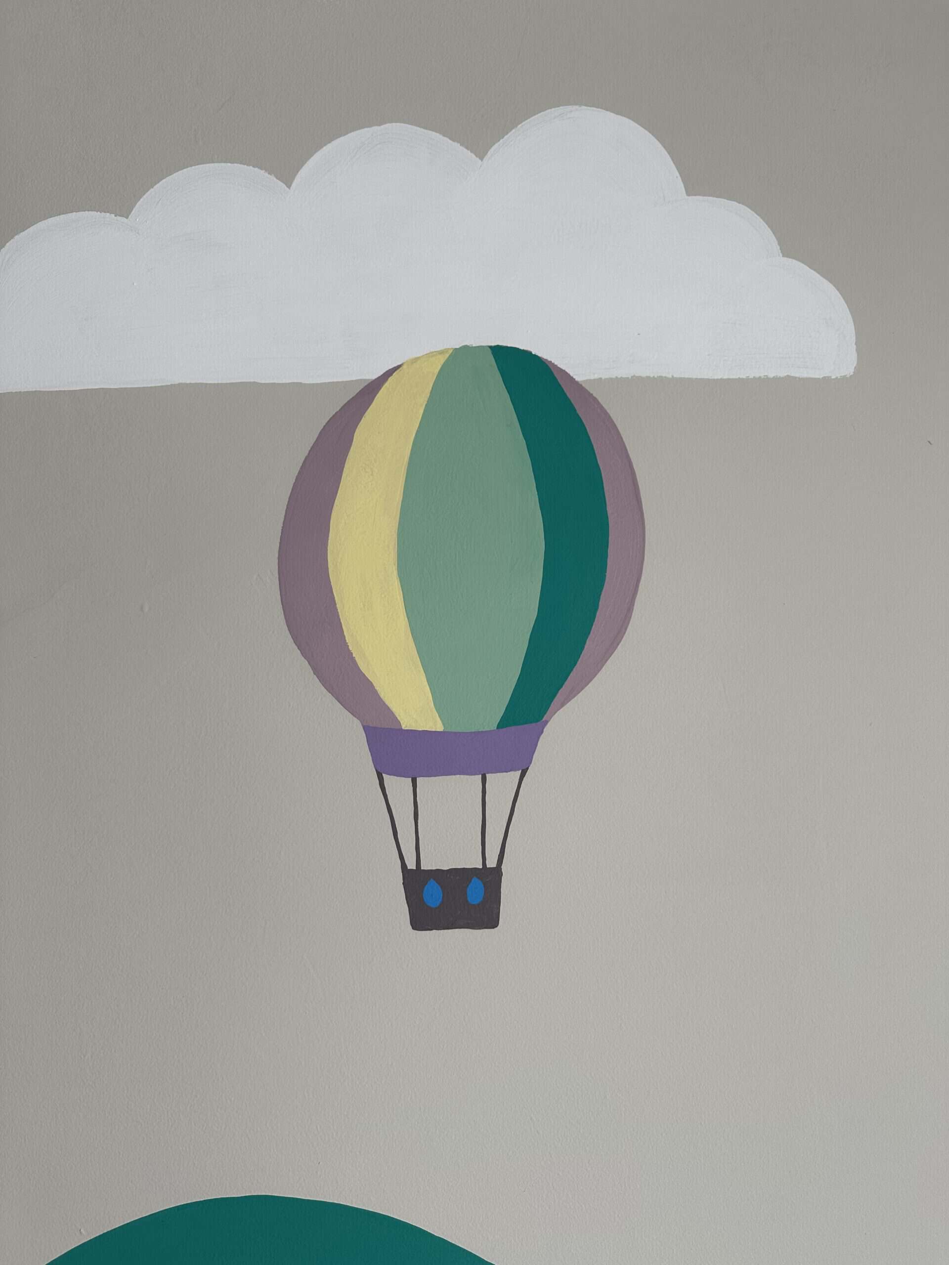 Decorative hot air balloon mural with cloud background for creative spaces.